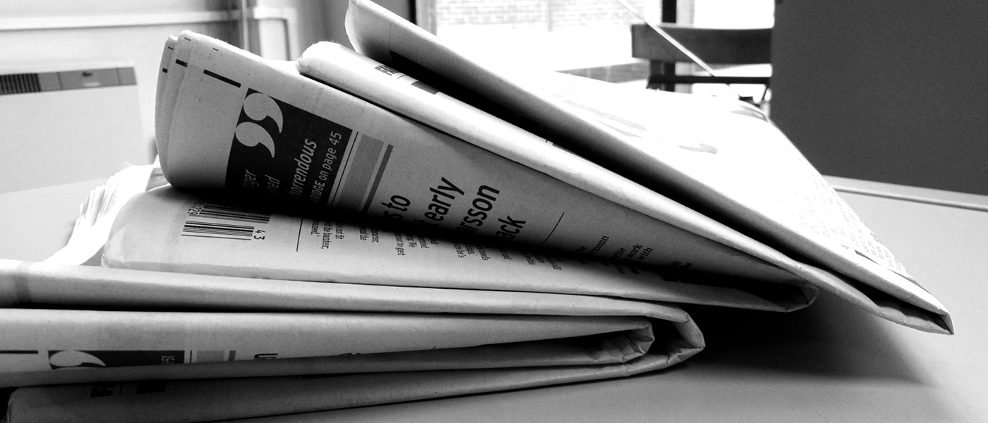 Stack of newspapers. Source: Jon S. via Flickr.